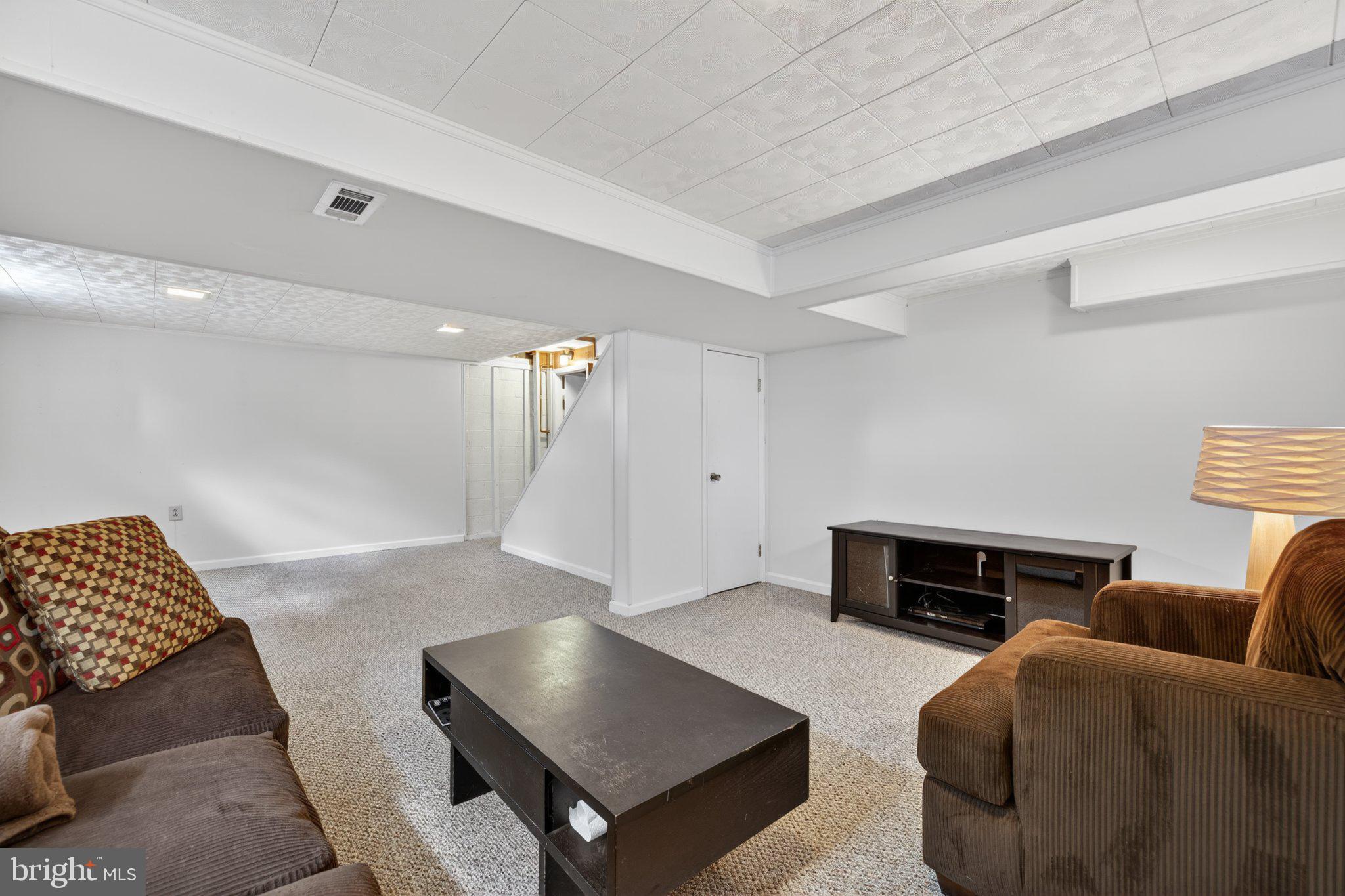 1002 Wilson Place Frederick, MD 21702 - Photo 24 of 30 a living room with furniture and a couch
