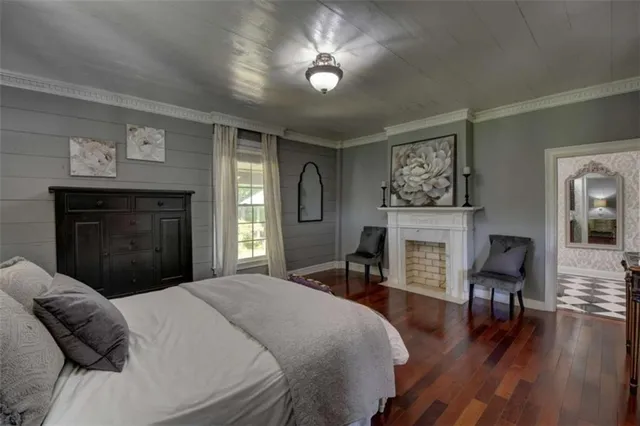 a view of living room with furniture and wooden floor