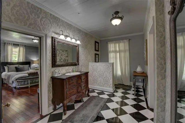 a kitchen with stainless steel appliances granite countertop a sink a stove and a wooden floors