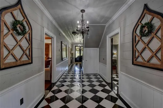 a kitchen with stainless steel appliances granite countertop wooden floors and view living room