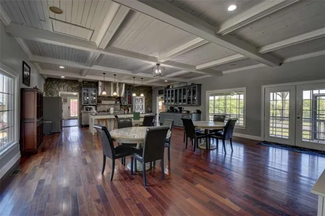a kitchen with stainless steel appliances granite countertop a stove and cabinets