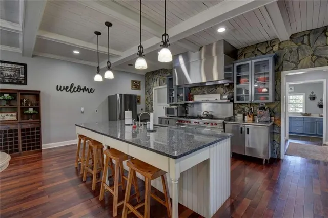 a bathroom with a sink mirror and vanity
