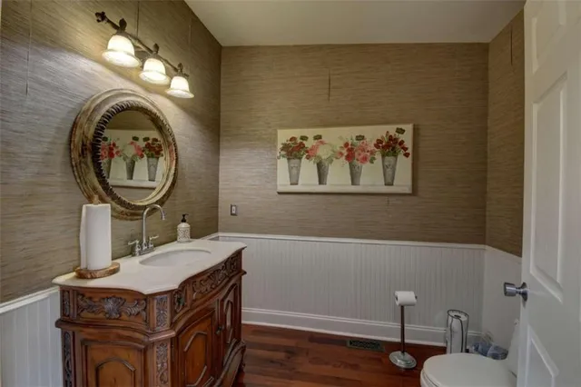 a bedroom with furniture and a fireplace