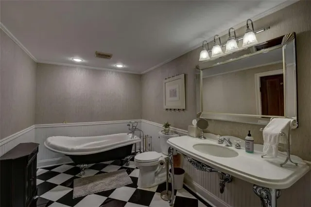 a living room with furniture or wooden floor and a potted plant