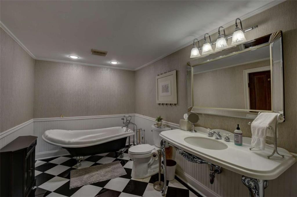 7527 Highway 326 Commerce, GA 30530 - Photo 34 of 57 a bathroom with a sink and a mirror