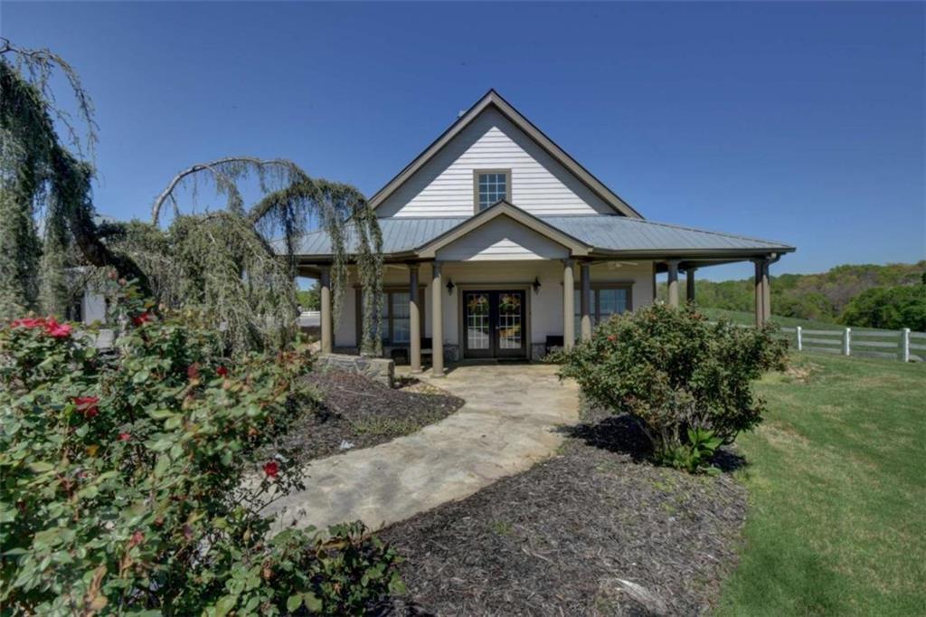 7527 Highway 326 Commerce, GA 30530 - Photo 35 of 57 a front view of a house with garden
