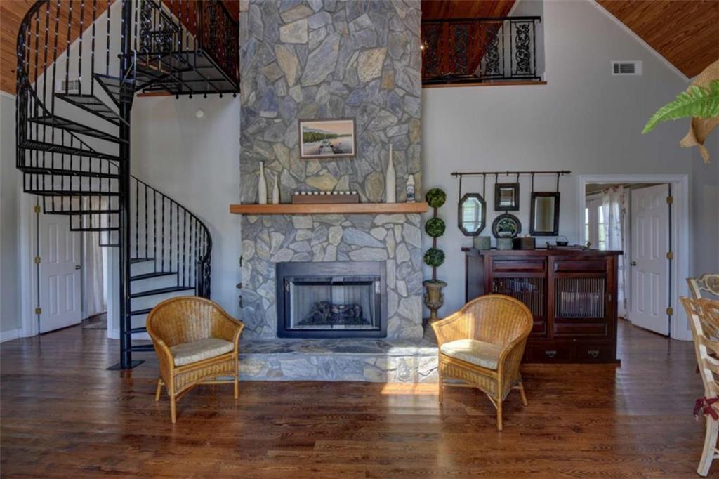 7527 Highway 326 Commerce, GA 30530 - Photo 37 of 57 a living room with furniture and a fireplace
