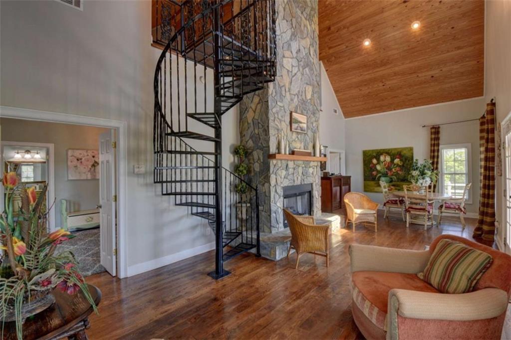 7527 Highway 326 Commerce, GA 30530 - Photo 38 of 57 a living room with furniture or wooden floor and a potted plant