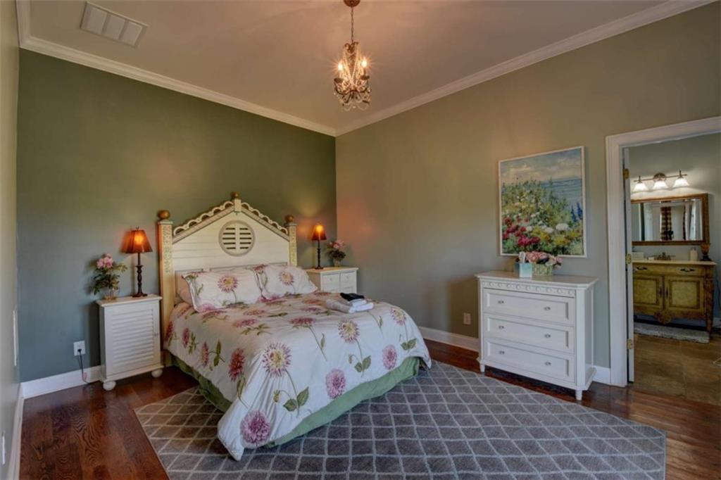 7527 Highway 326 Commerce, GA 30530 - Photo 41 of 57 a bedroom with a bed and wooden floor