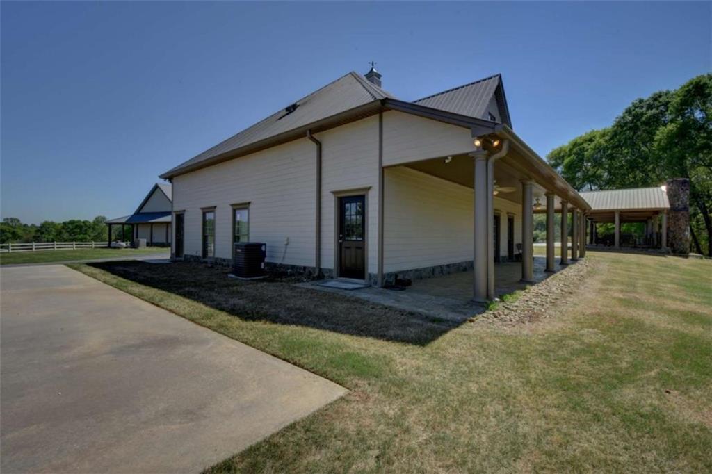 7527 Highway 326 Commerce, GA 30530 - Photo 48 of 57 a view of a house with a yard