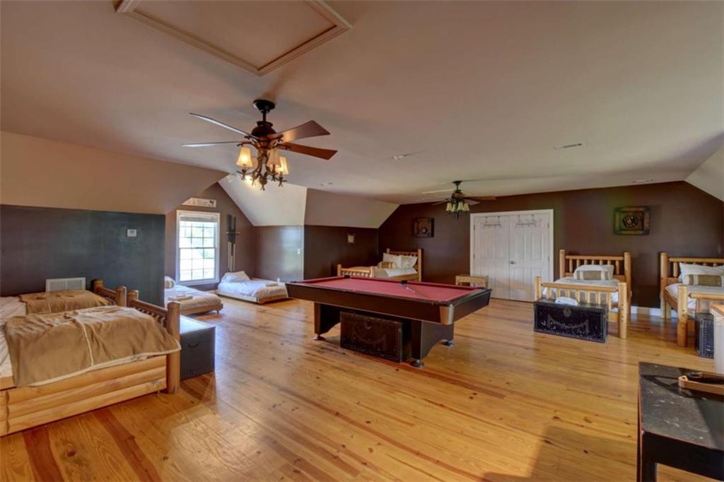 7527 Highway 326 Commerce, GA 30530 - Photo 54 of 57 a living room with furniture and a chandelier