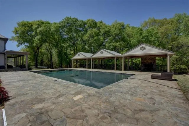a view of a swimming pool with a garden
