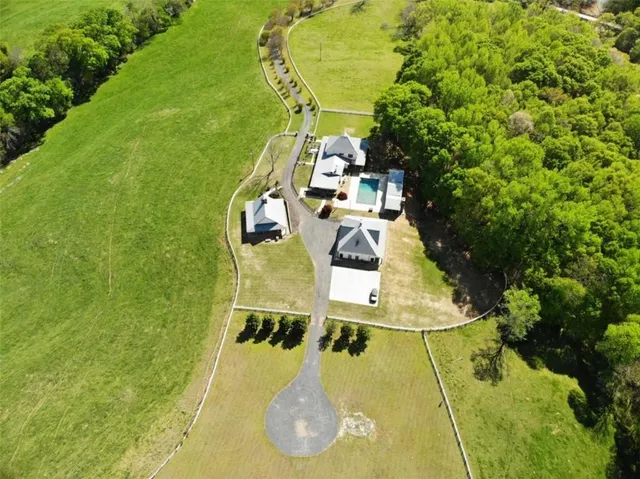 a living room with furniture a fireplace and wooden floor