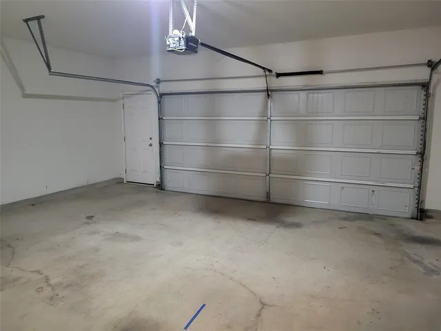 a kitchen with center island table and chairs