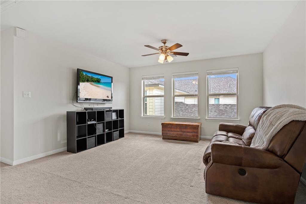 214 Diamond Point Drive Dripping Springs, TX 78620 - Photo 16 of 32 a bedroom with furniture and a window