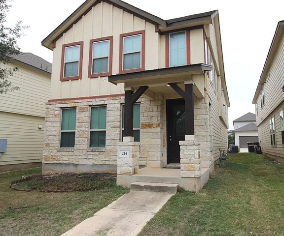 a kitchen with a sink a counter top space and living room