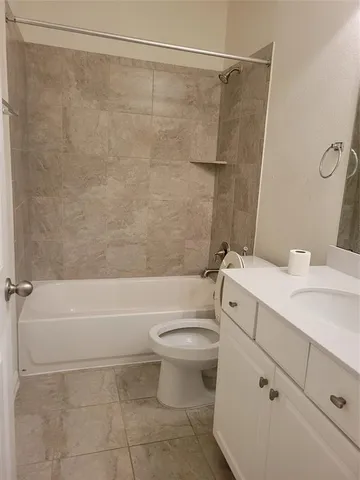 a bathroom with a sink a toilet and a bathtub