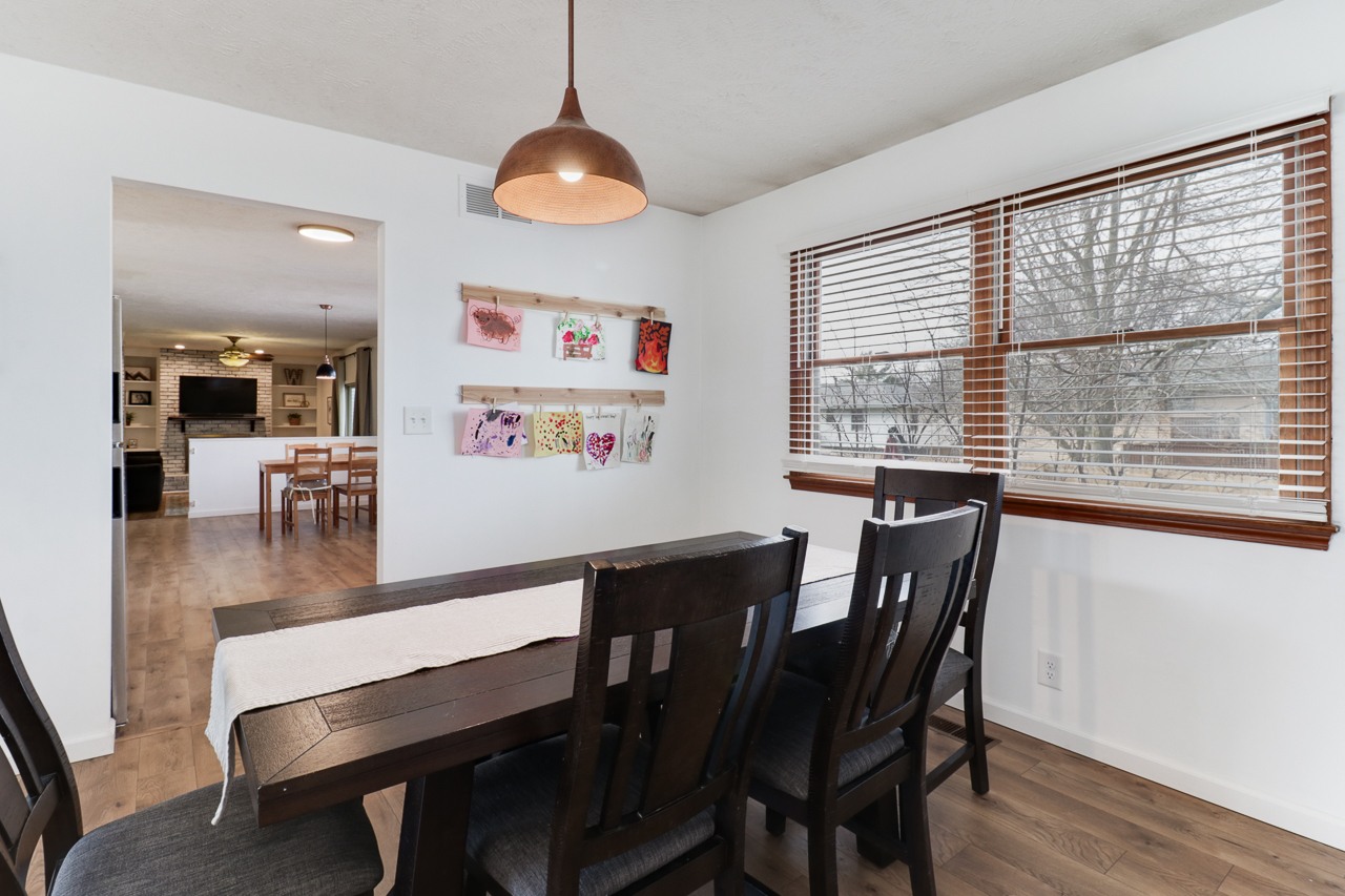 307 Garden Road Normal, IL 61761 - Photo 11 of 32 a view of a dining room with furniture wooden floor and chandelier