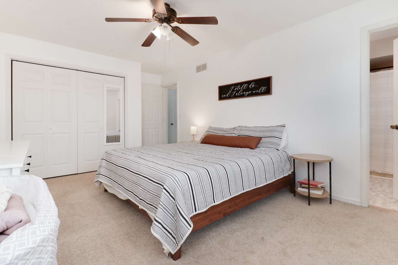 307 Garden Road Normal, IL 61761 - Photo 15 of 32 a bedroom with a bed and cabinets