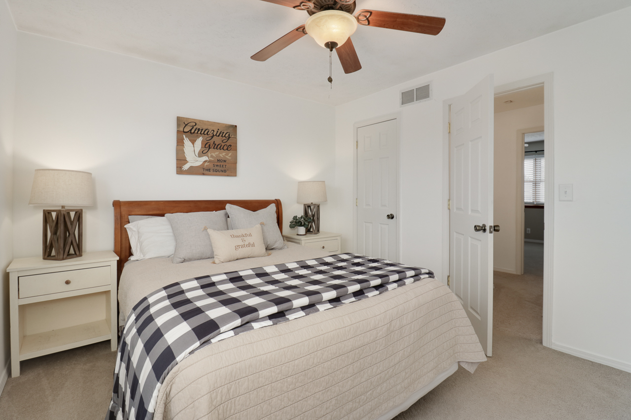 307 Garden Road Normal, IL 61761 - Photo 20 of 32 a bedroom with a bed and a chandelier