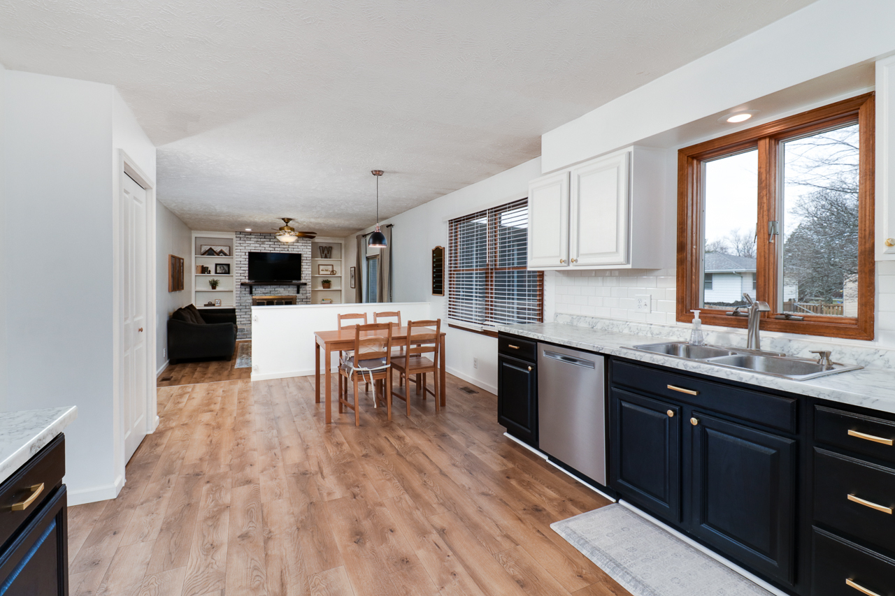 307 Garden Road Normal, IL 61761 - Photo 6 of 32 a kitchen with stainless steel appliances granite countertop sink stove top oven and cabinets