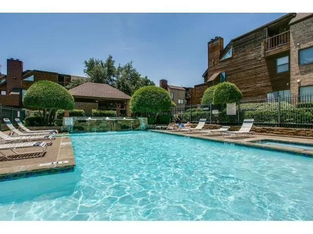 a swimming pool with outdoor seating and yard
