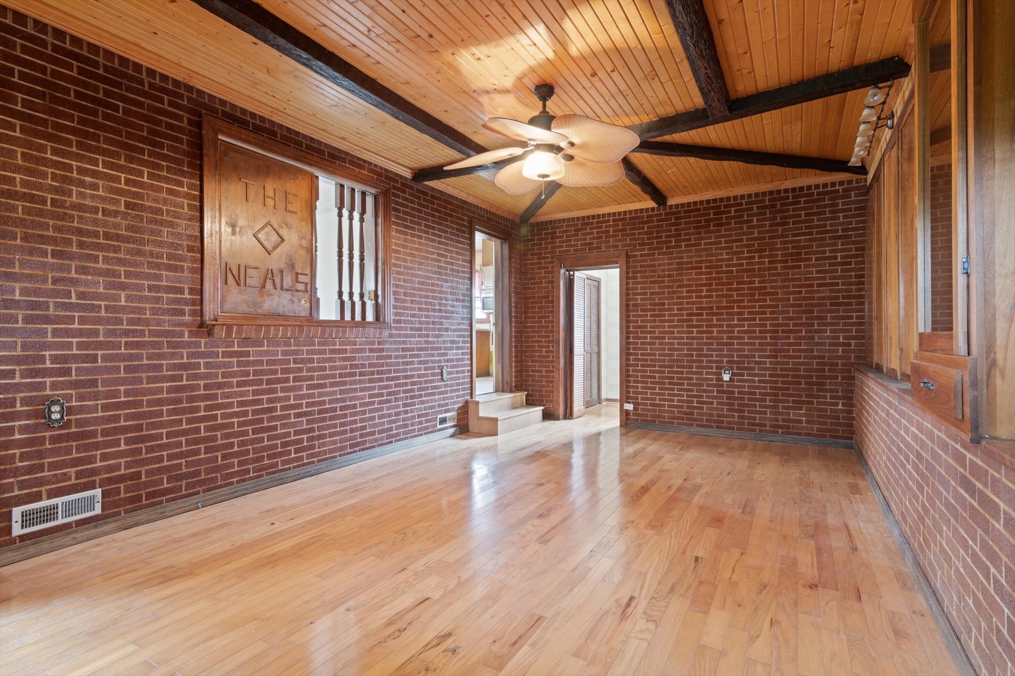 5429 Baxter Road Baxter, TN 38544 - Photo 11 of 36 a view of an empty room with wooden floor and a fan