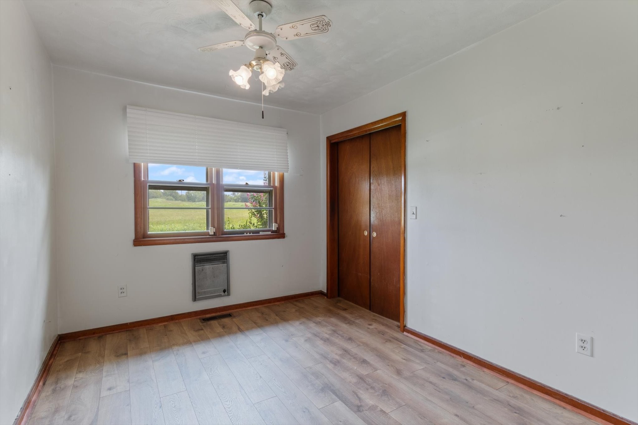 5429 Baxter Road Baxter, TN 38544 - Photo 12 of 36 an empty room with wooden floor and windows