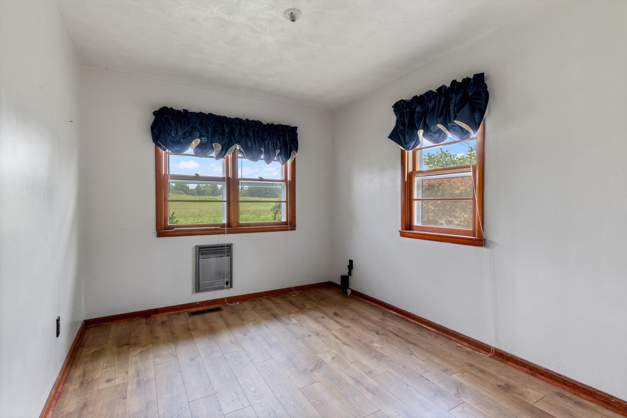 5429 Baxter Road Baxter, TN 38544 - Photo 13 of 36 an empty room with wooden floor and windows