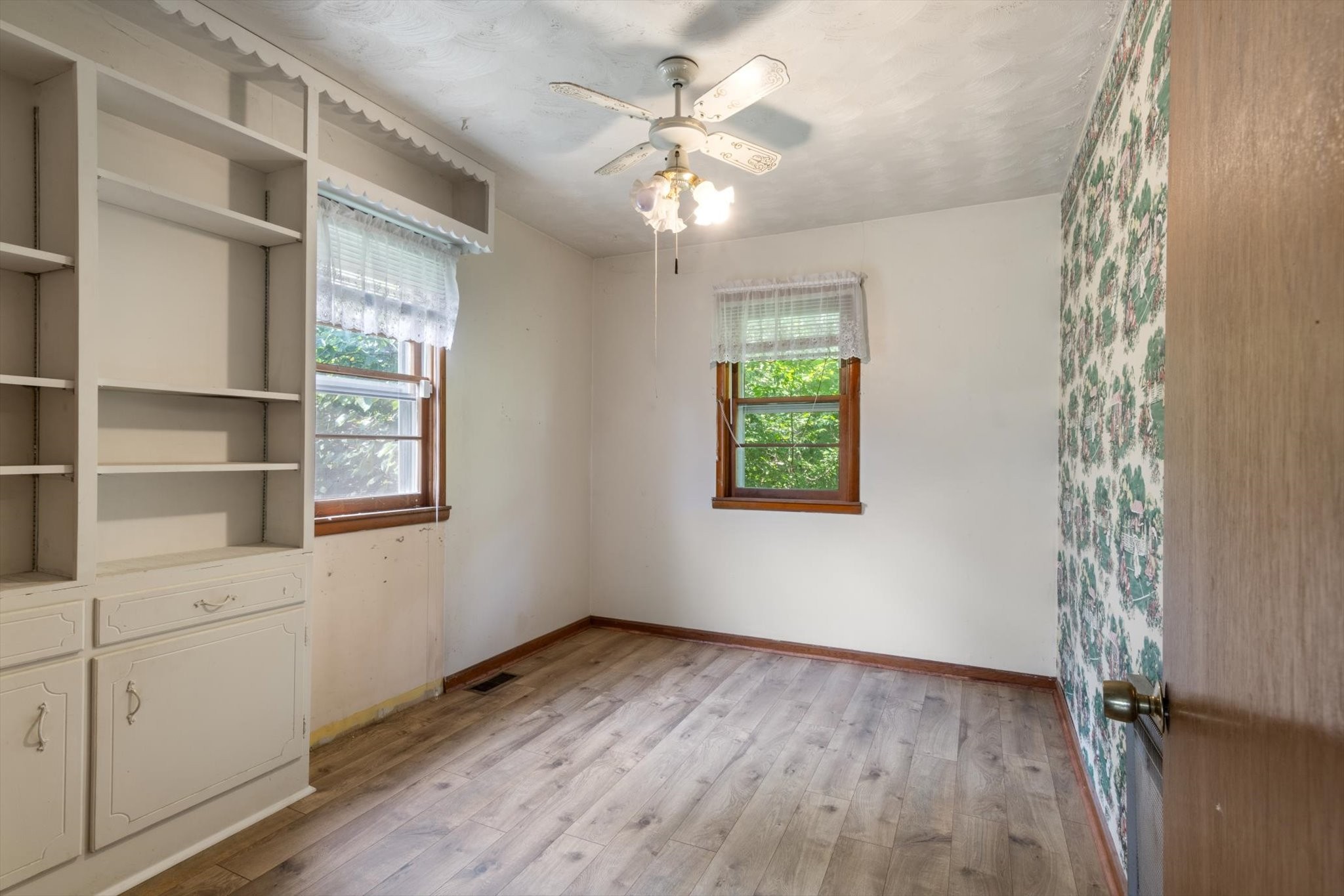 5429 Baxter Road Baxter, TN 38544 - Photo 14 of 36 a view of an empty room with a window and wooden floor