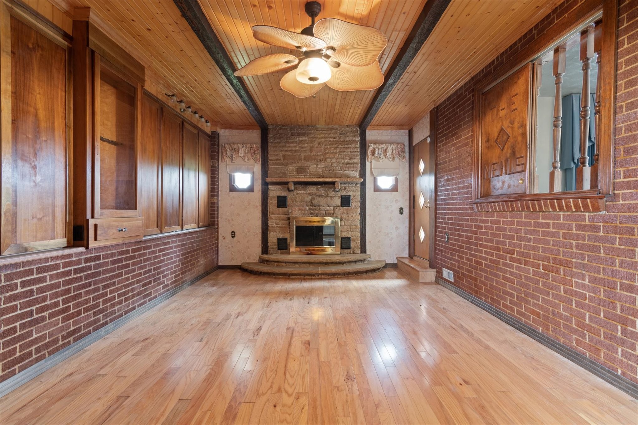 5429 Baxter Road Baxter, TN 38544 - Photo 10 of 36 a view of a hallway with wooden floor and a fireplace