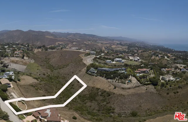 an aerial view of residential house with outdoor space