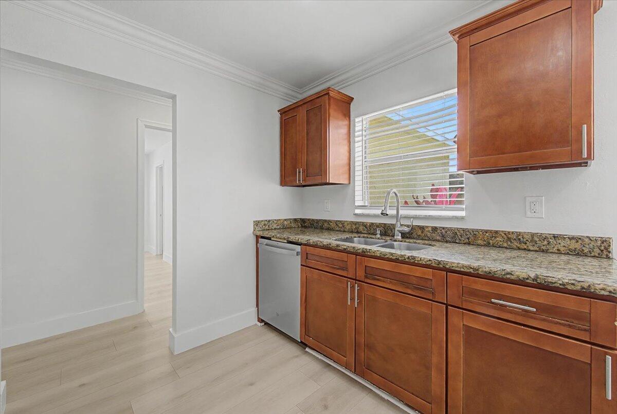 7781 Northwest 46th Street Lauderhill, FL 33351 - Photo 11 of 42 a bathroom with a granite countertop sink and a mirror