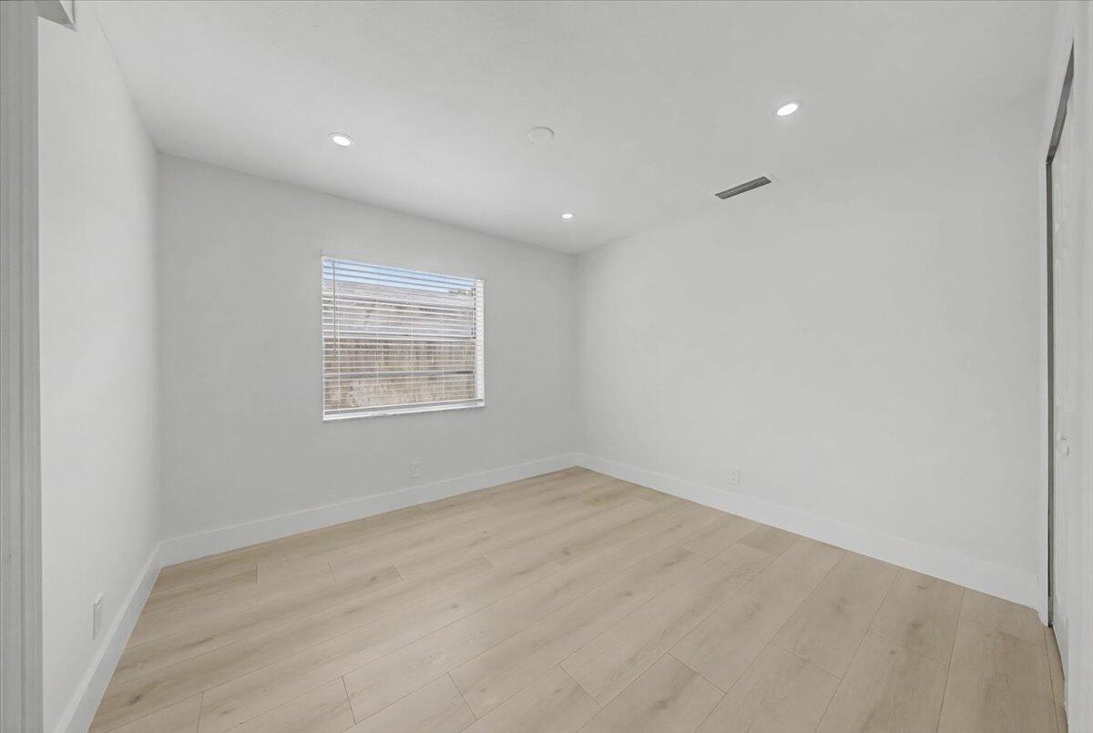 7781 Northwest 46th Street Lauderhill, FL 33351 - Photo 16 of 42 an empty room with windows