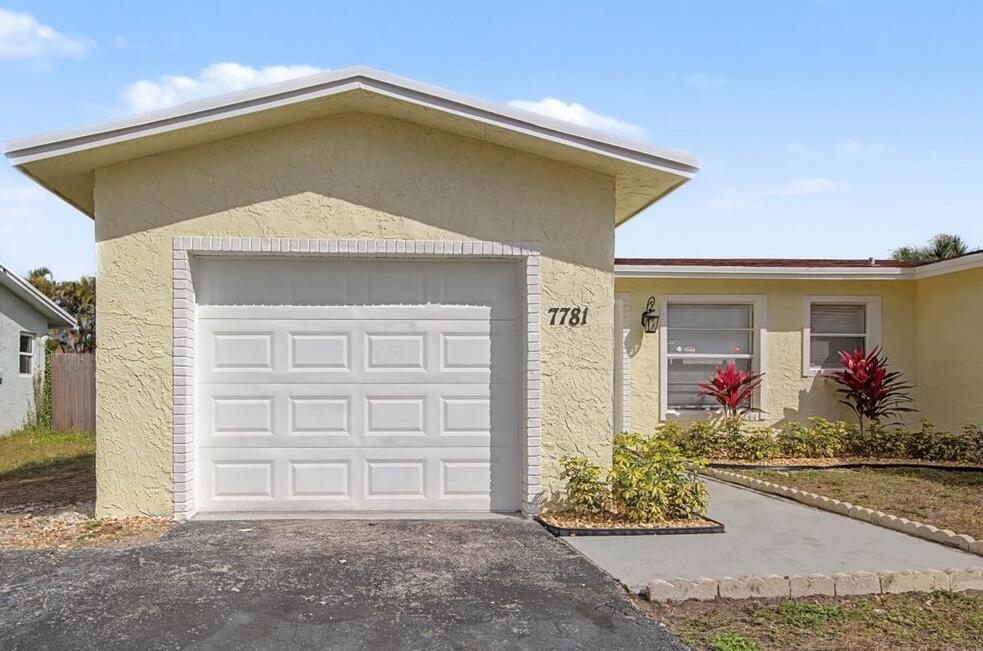 7781 Northwest 46th Street Lauderhill, FL 33351 - Photo 3 of 42 a front view of a house