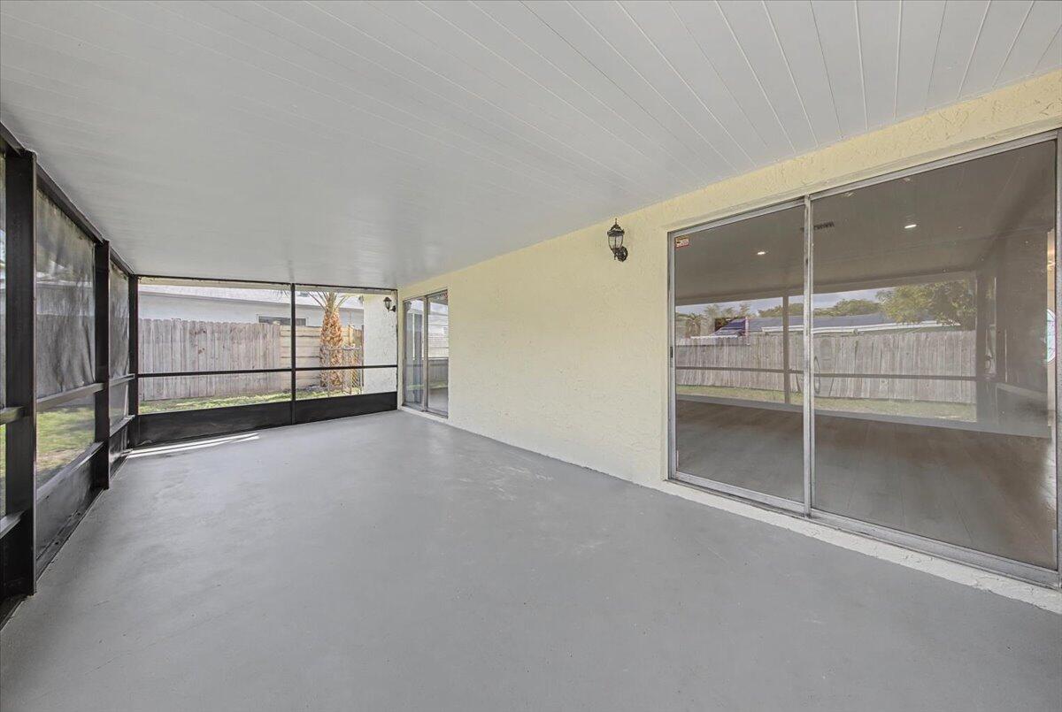 7781 Northwest 46th Street Lauderhill, FL 33351 - Photo 34 of 42 an empty room with sliding glass door and shower