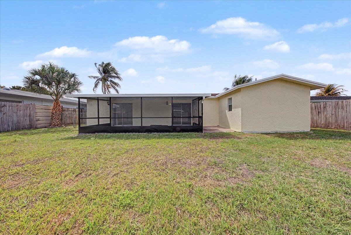 7781 Northwest 46th Street Lauderhill, FL 33351 - Photo 39 of 42 a view of a backyard with a garden