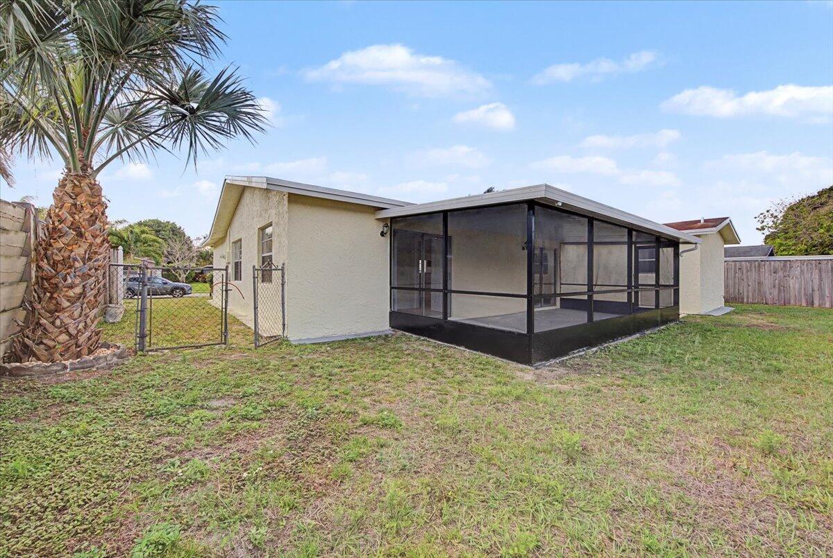 7781 Northwest 46th Street Lauderhill, FL 33351 - Photo 42 of 42 a house with a yard