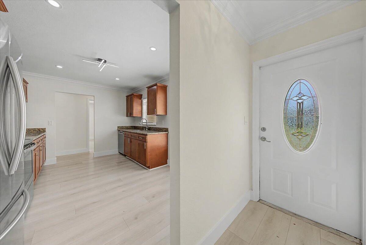 7781 Northwest 46th Street Lauderhill, FL 33351 - Photo 8 of 42 an empty room with a fireplace and a window