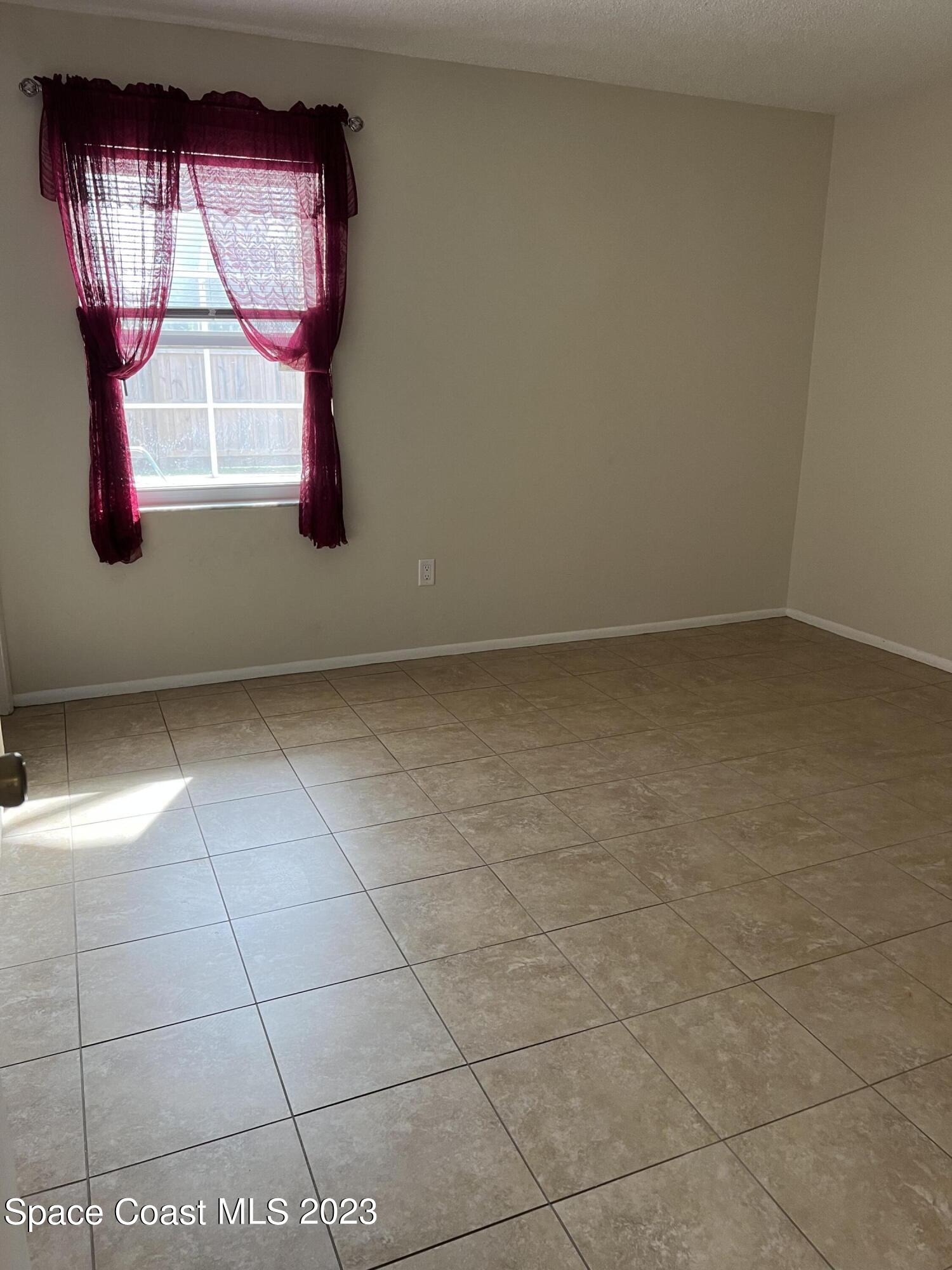 283 Fecco Street Cocoa, FL 32927 - Photo 13 of 25 a view of empty room with window