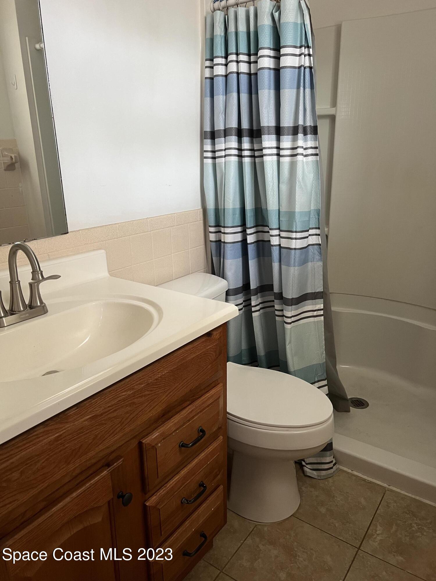 283 Fecco Street Cocoa, FL 32927 - Photo 15 of 25 a bathroom with a sink toilet and shower