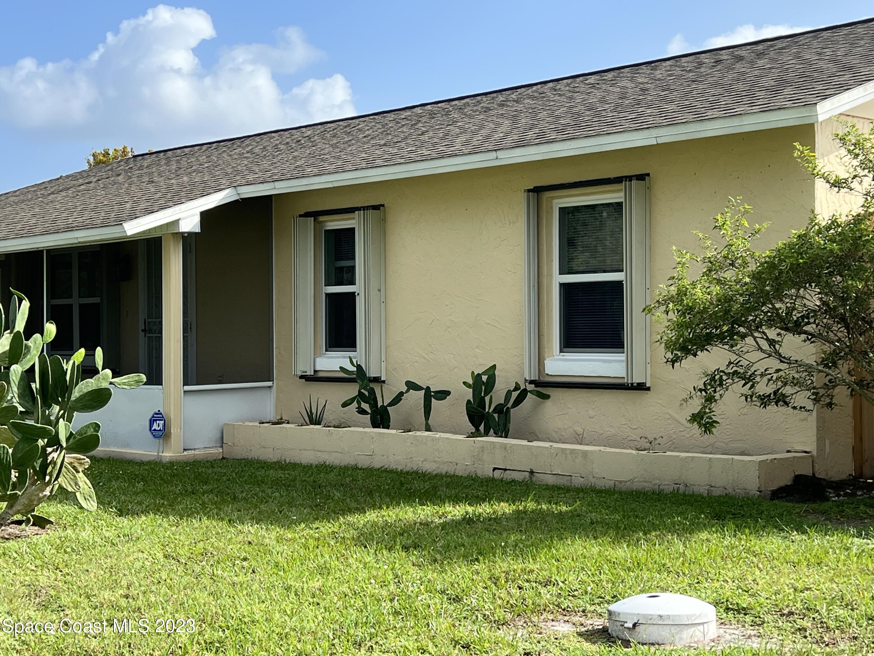 283 Fecco Street Cocoa, FL 32927 - Photo 2 of 25 a view of a house with backyard