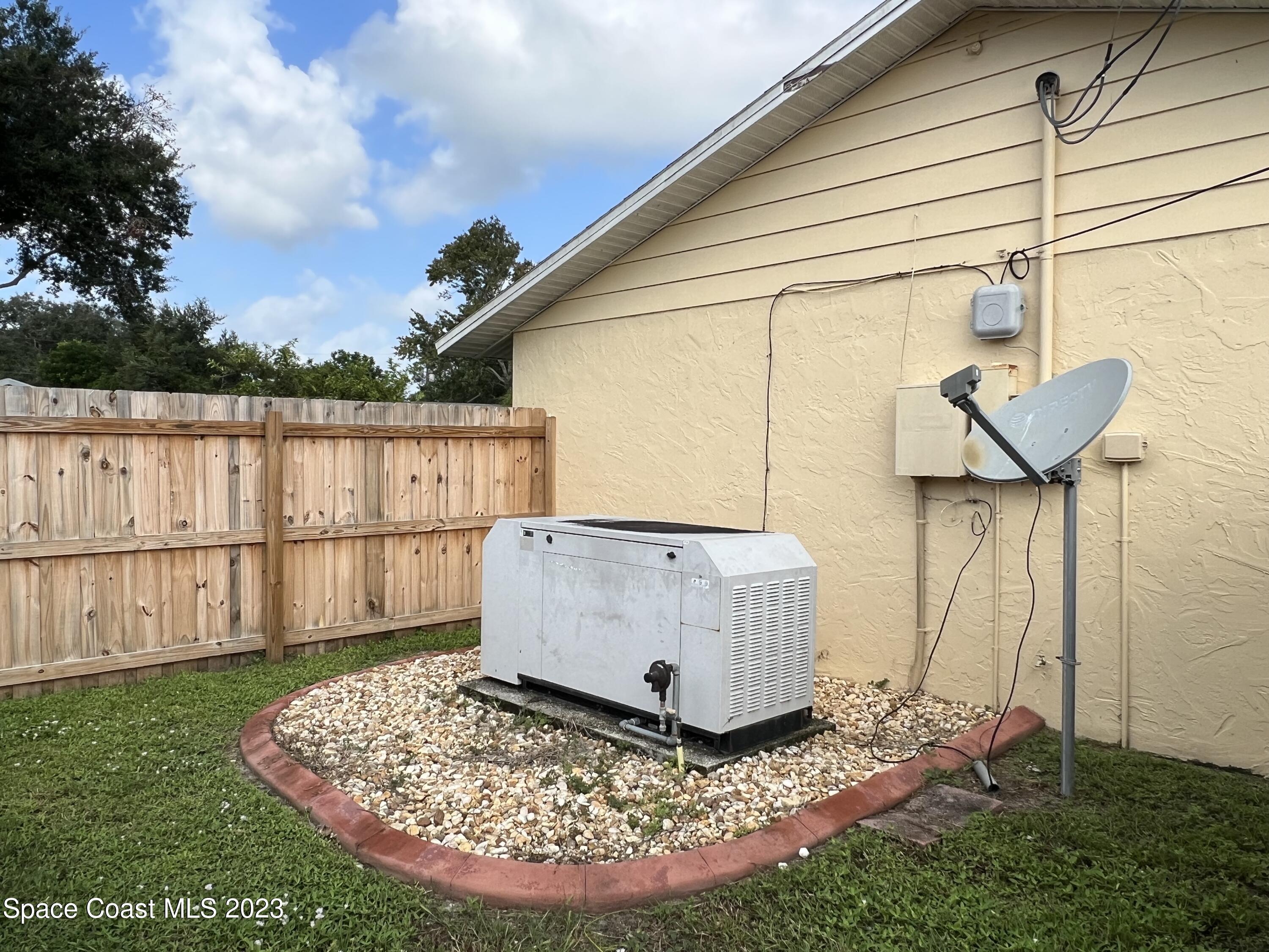 283 Fecco Street Cocoa, FL 32927 - Photo 22 of 25 a view of a backyard with a tub