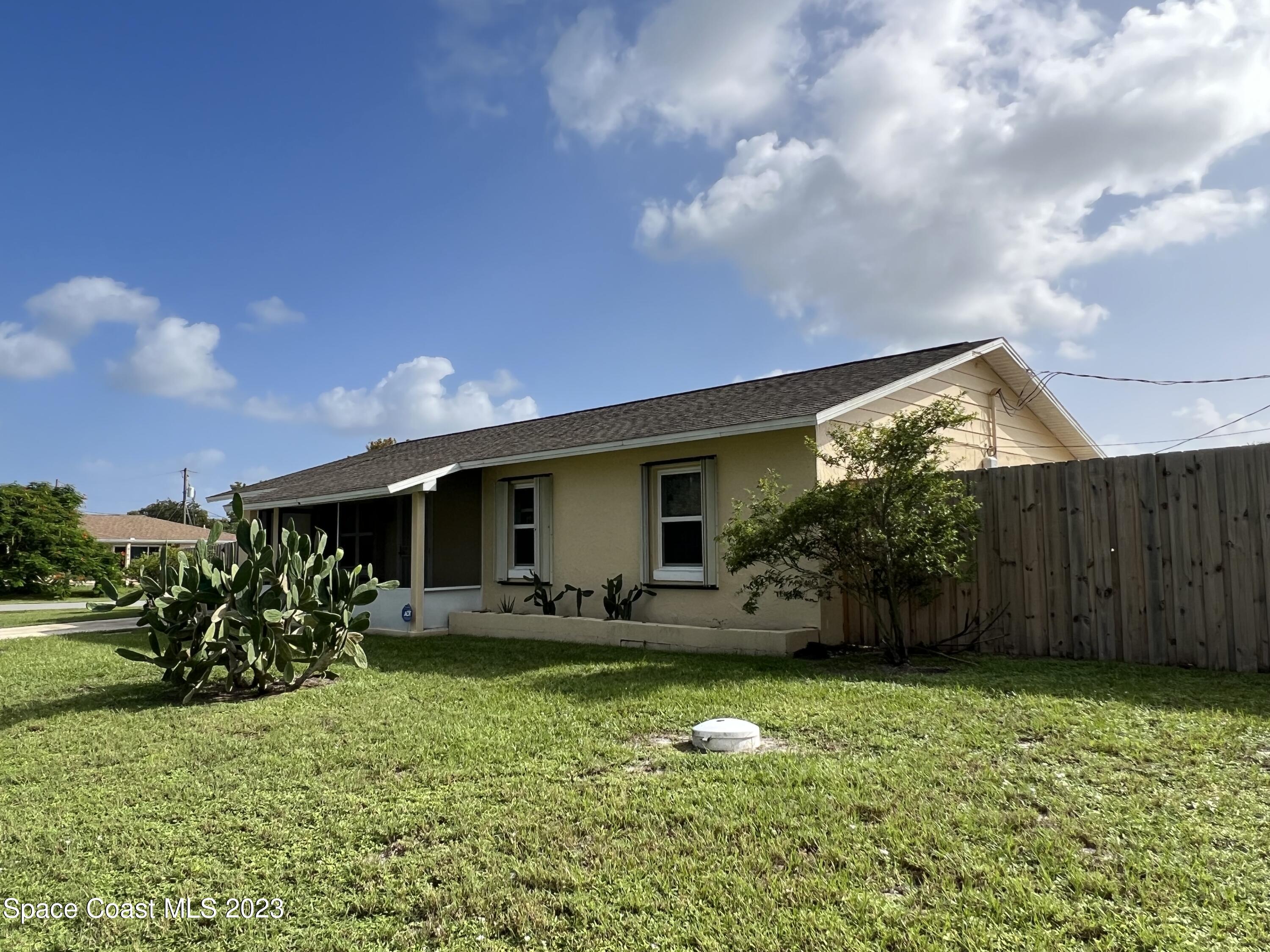 283 Fecco Street Cocoa, FL 32927 - Photo 24 of 25 a house view with swimming pool and garden space