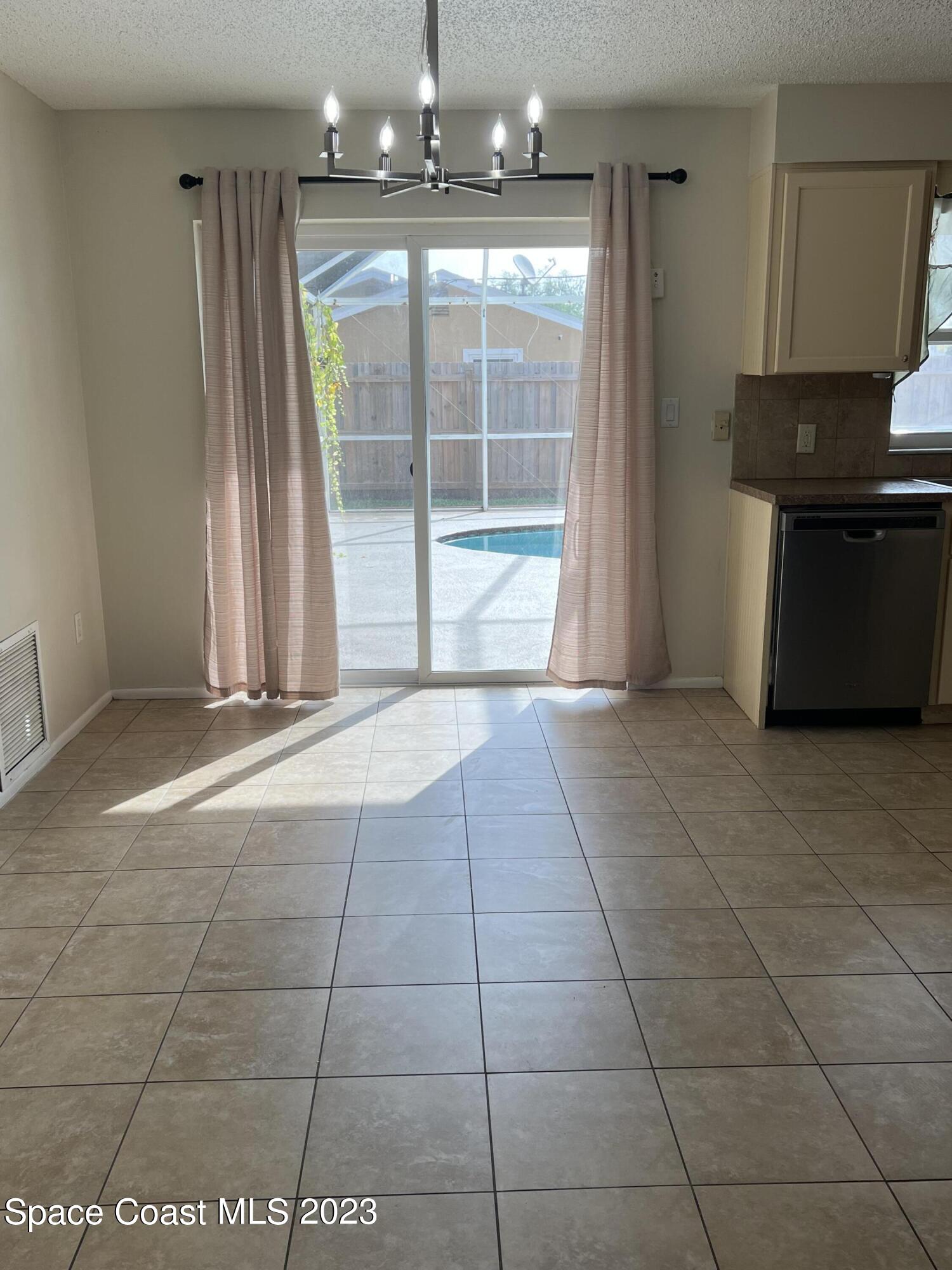 283 Fecco Street Cocoa, FL 32927 - Photo 5 of 25 a view of entryway with kitchen