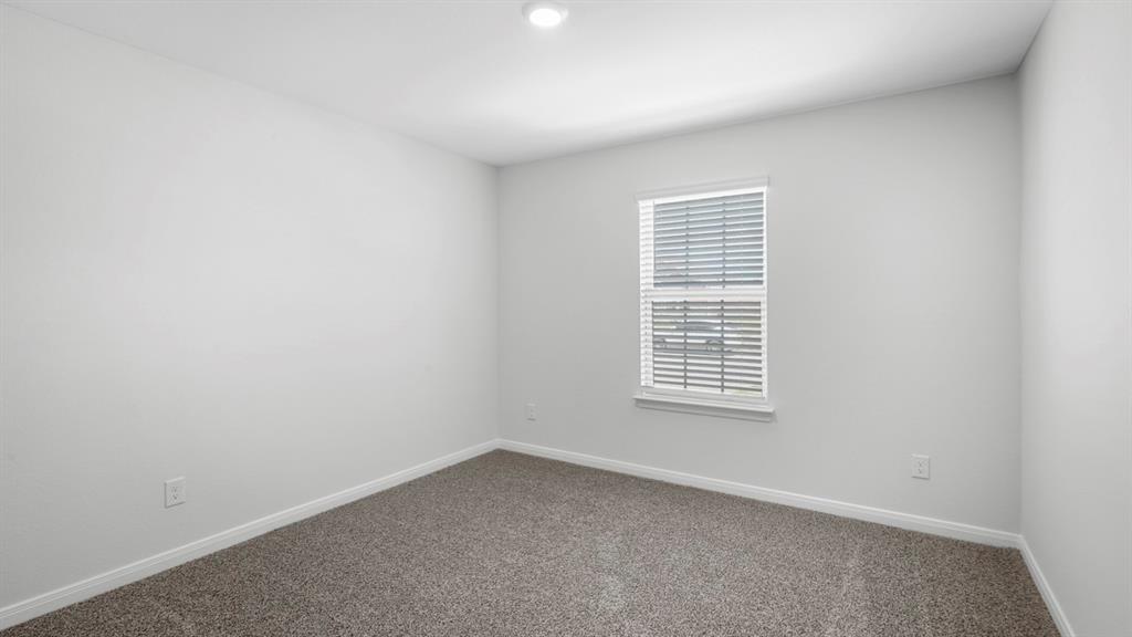 1921 Reveille Way Terrell, TX 75160 - Photo 3 of 30 an empty room with a window