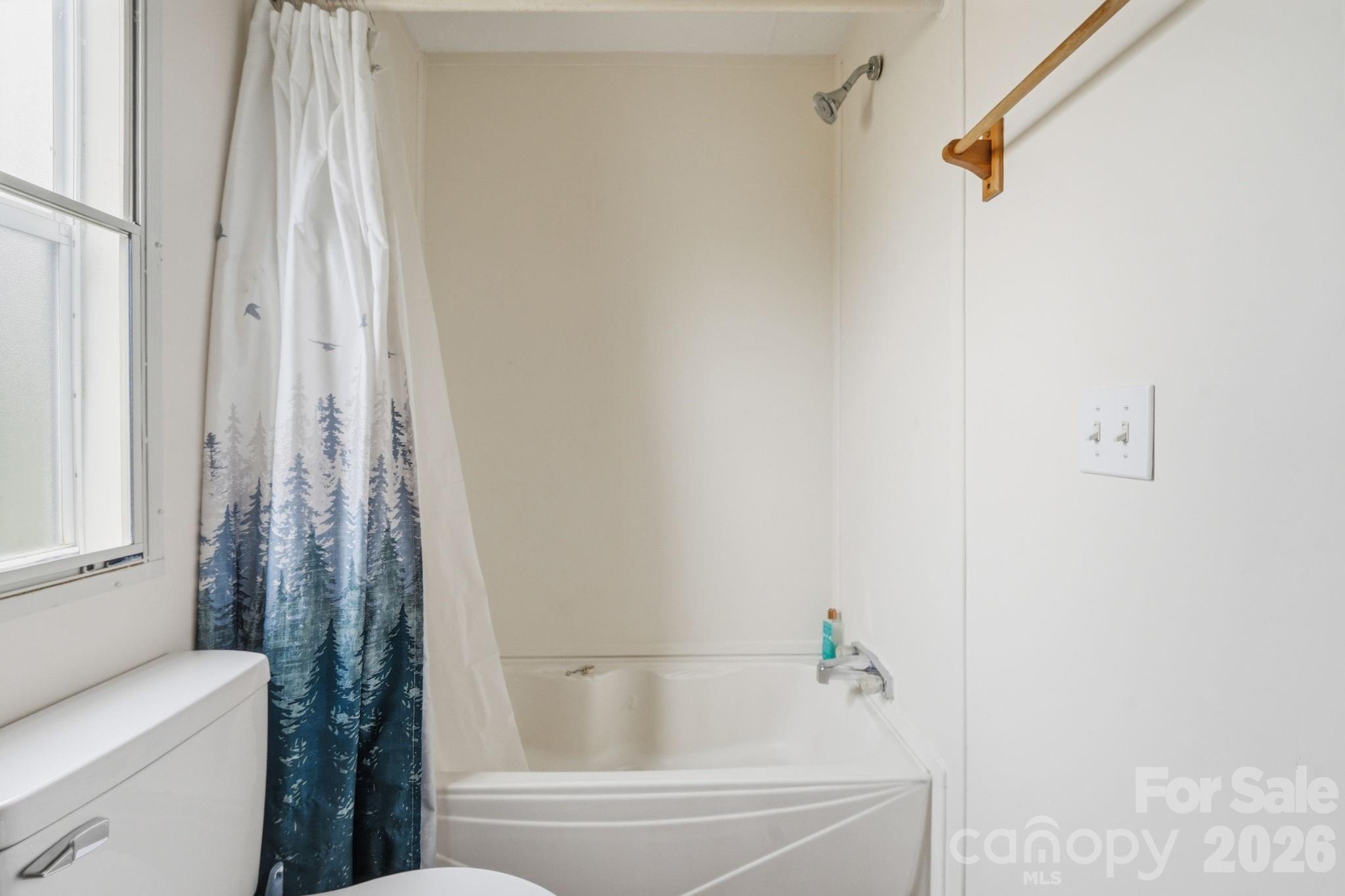 2862 Eagle Point Drive Trinity, NC 27370 - Photo 19 of 31 a bathroom with a shower curtain and a sink