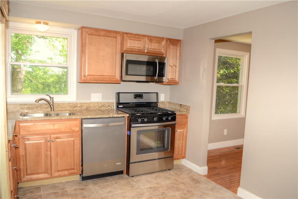 131 McIntyre Road Pittsburgh, PA 15237 - Photo 6 of 25 New kitchen includes ceramic tile flooring and stainless appliances