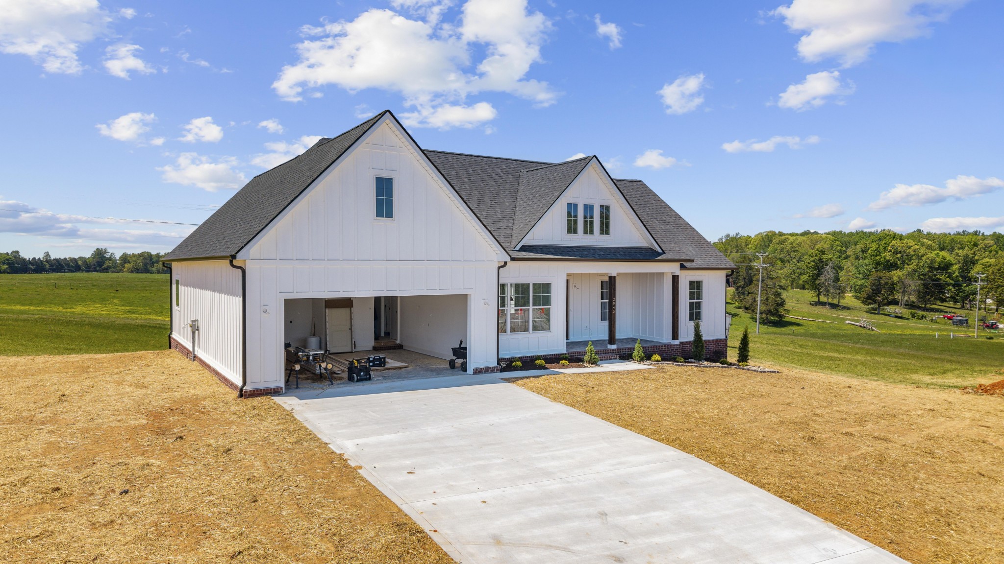 2945 Cane Creek Road Cookeville, TN 38506 - Photo 2 of 15 a front view of a house with a yard and garage