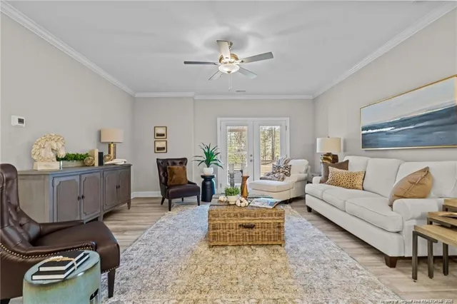 a living room with furniture and wooden floor